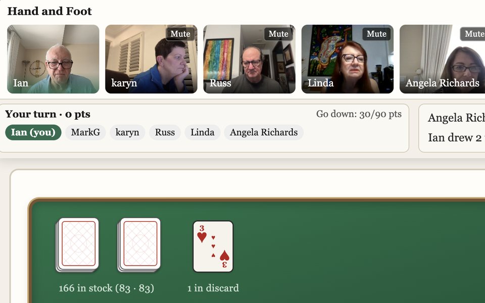 A real Hand and Foot table: six players on video along the top, a hand of cards below.
